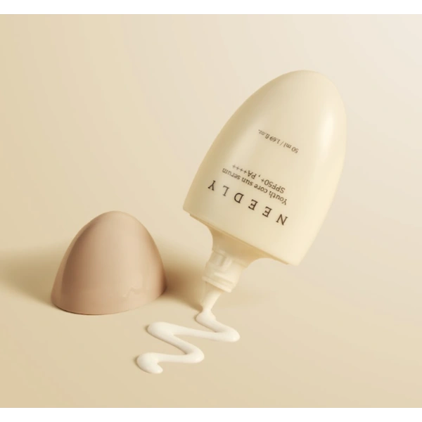 Сонцезахисна крем-сироватка потрійної дії